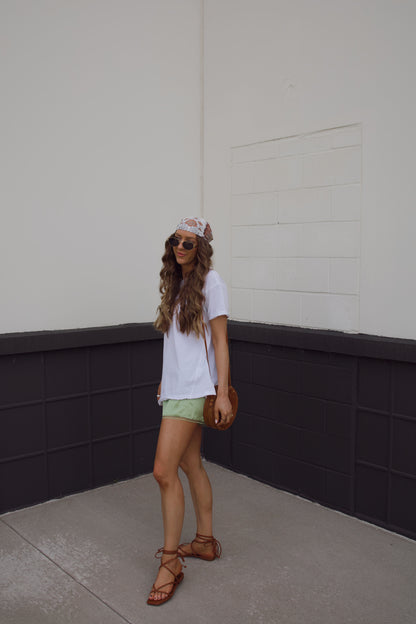 off the shoulder top with green satin lace shorts